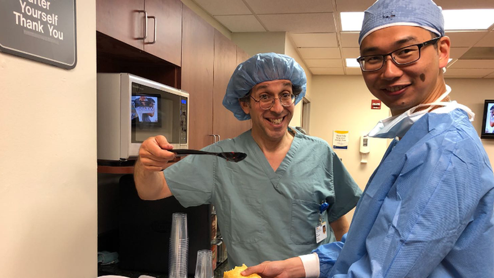 Professor Lew Schon, Professor of Orthopaedics, Johns Hopkins School of Medicine with Dr Kar Hao Teoh. Both are wearing surgical scrubs.