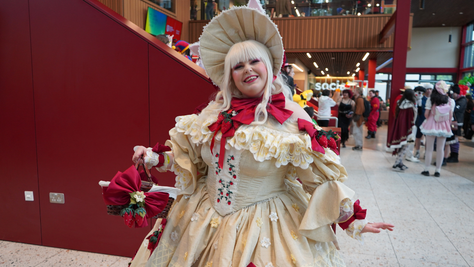 Woman in dress at QCon