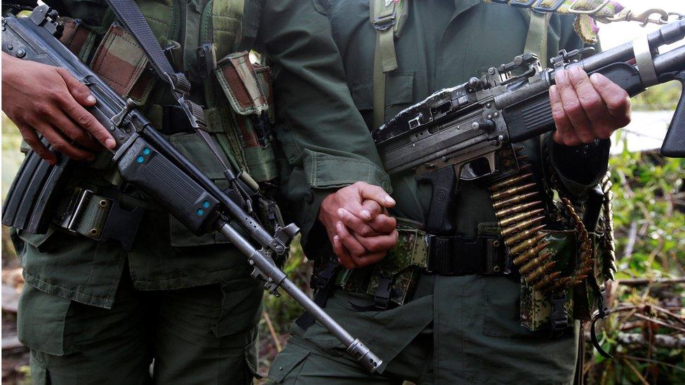 A couple from the 51st Front of the Revolutionary Armed Forces of Colombia (FARC) pose for the camera at a camp in Cordillera Oriental, Colombia, 16 August 2016.