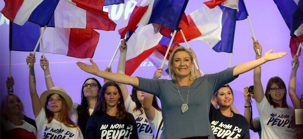 France's far-right National Front president Marine Le Pen waves to supporters during a summer meeting in Frejus, southern France in September 2016