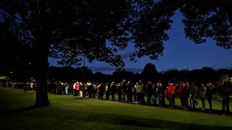 Members of the public queue in George Square Gardens to pay their respects before the coffin of Queen Elizabeth II lying at rest in Giles' Cathedral, in Edinburgh.