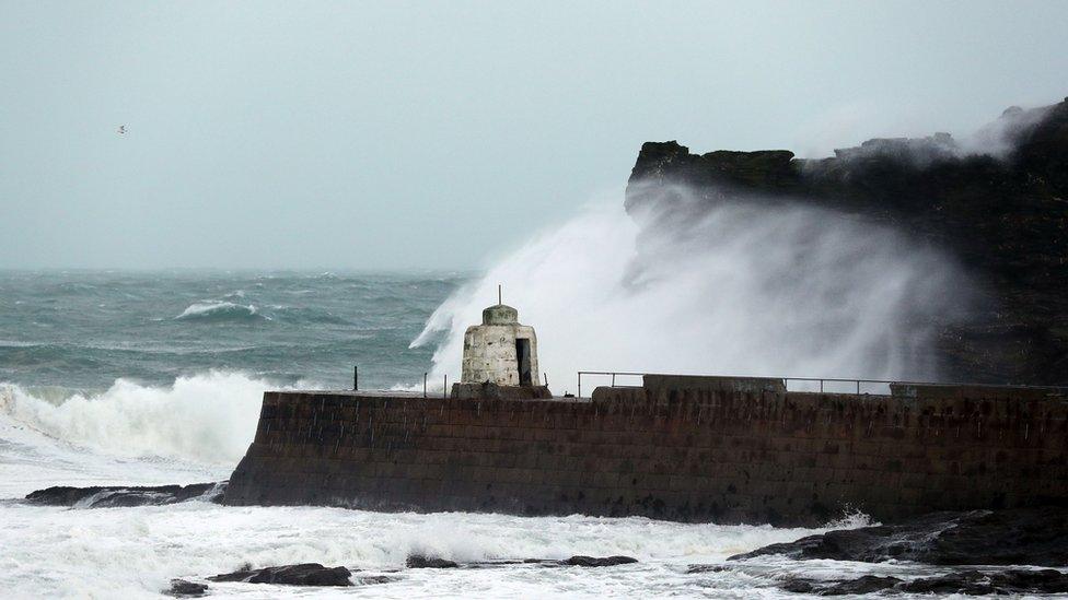 Waves crashing against cliffs in Portreath during Storm Eleanor