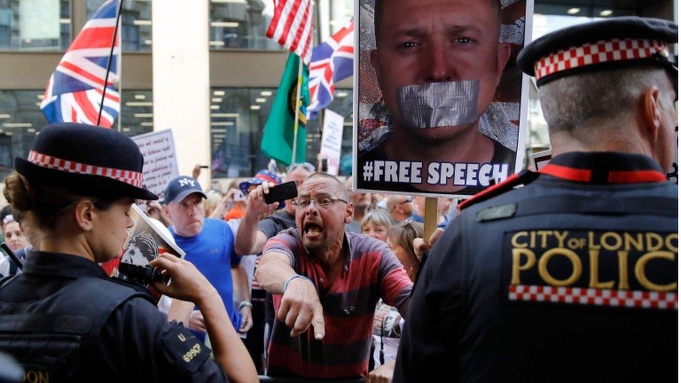 Supporters shouting at police outside the Old Bailey