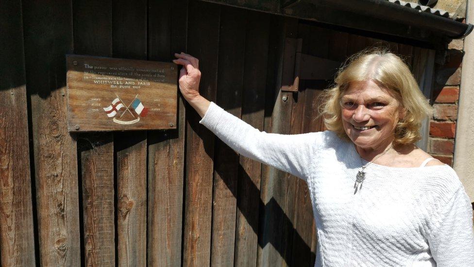 Julie Healey with the plaque