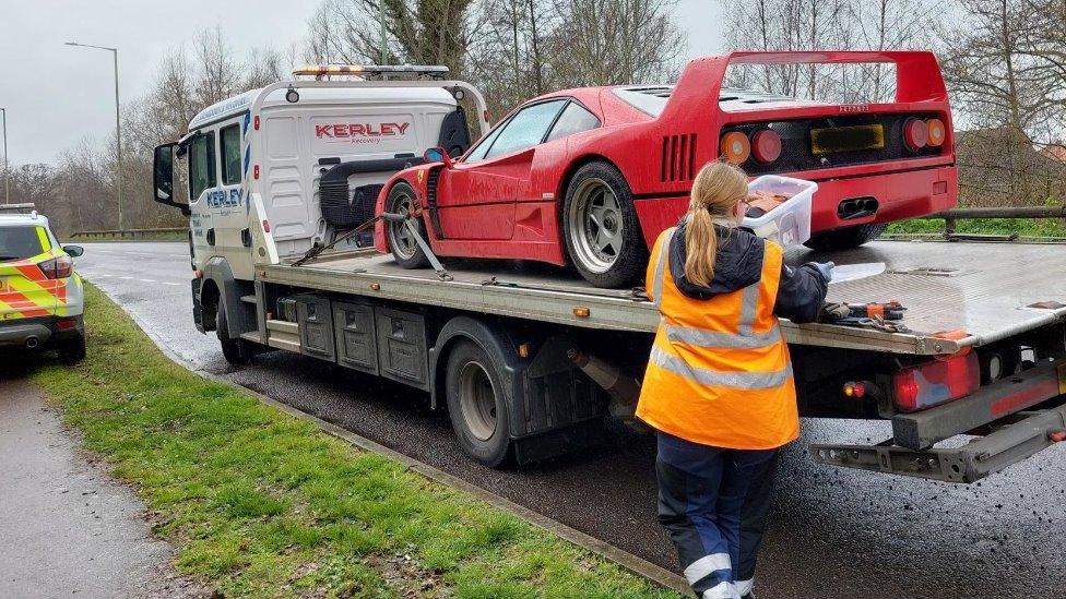 Ferrari on a recovery truck