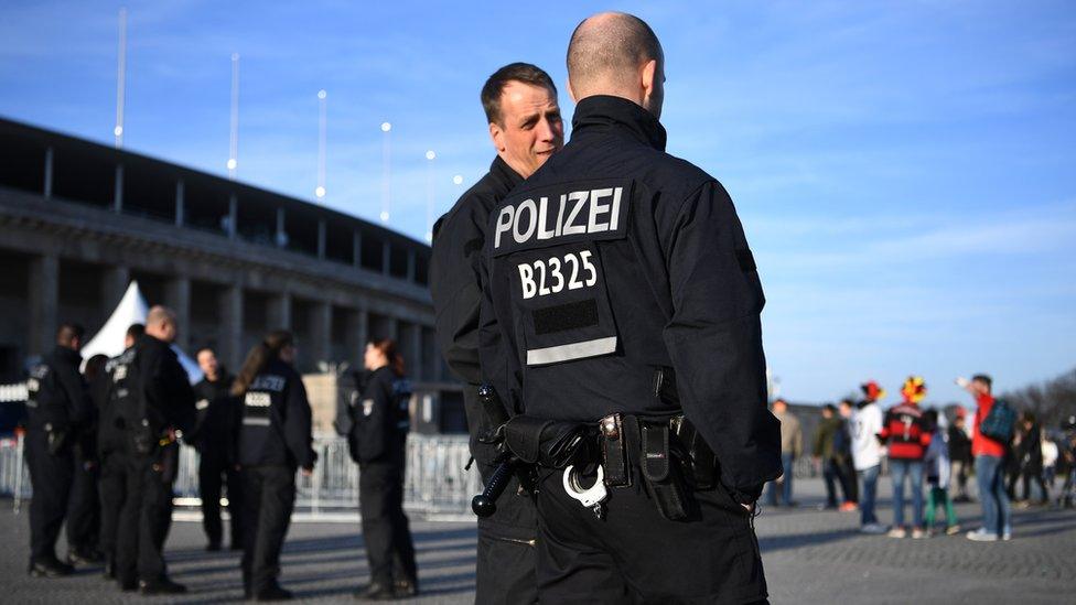 Policemen patrol outside the ground prior to the International Friendly match between Germany and England