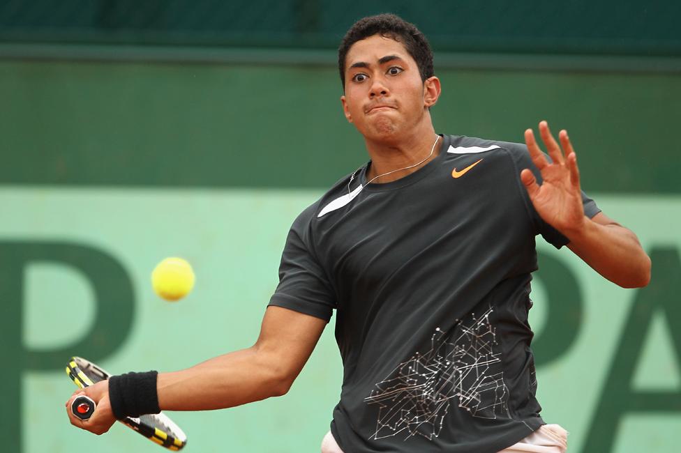 Karim Hossam plays a forehand during his boys' singles first round match against Liam Broady of Great Britain during day nine of the French Open at Roland Garros on June 4, 2012 in Paris