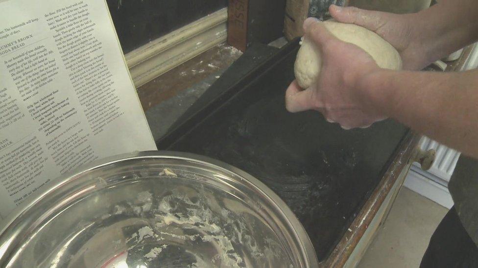 Jacob Anthony kneading bread