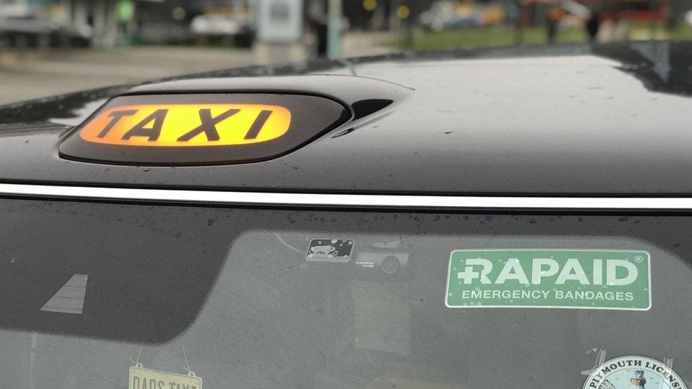 Rapaid sign on a Plymouth taxi