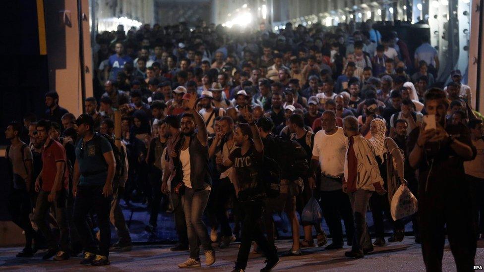 Syrian refugees disembark a ferry at the port of Piraeus, near Athens, Greece, 01 September 2015.