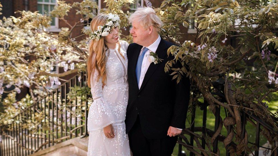 Boris Johnson with Carrie in wedding outfits