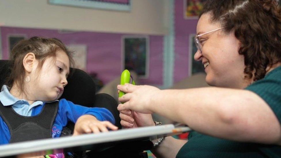 Teacher Leigh Wharton with a pupil