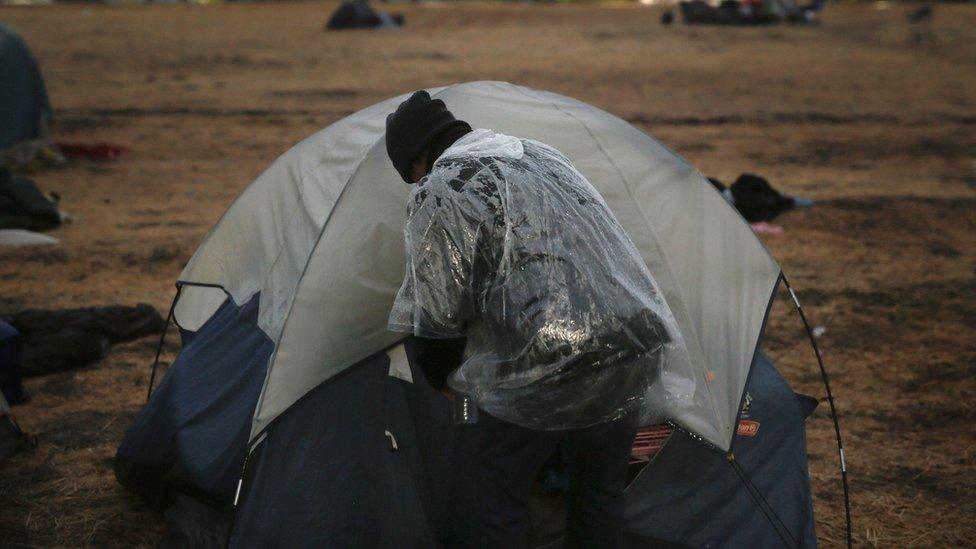 A fire evacuee enters in his tent near Walmart, Chico, on 21 November 2018