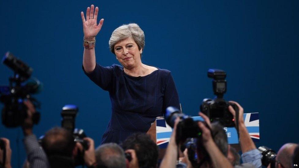 Theresa May at the end of her speech in Manchester