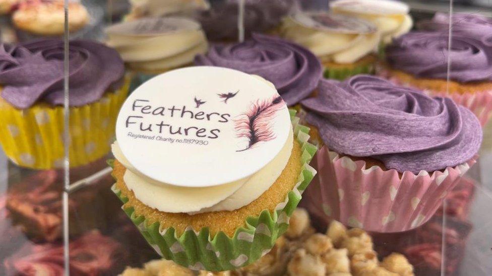 Feathers Future logo decorated on cup cake