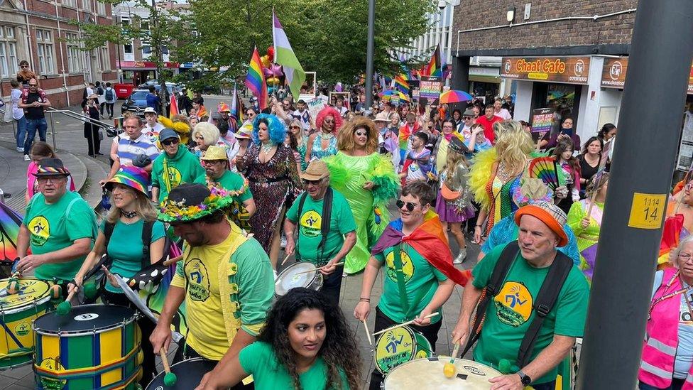 People playing samba drums at the Pride event