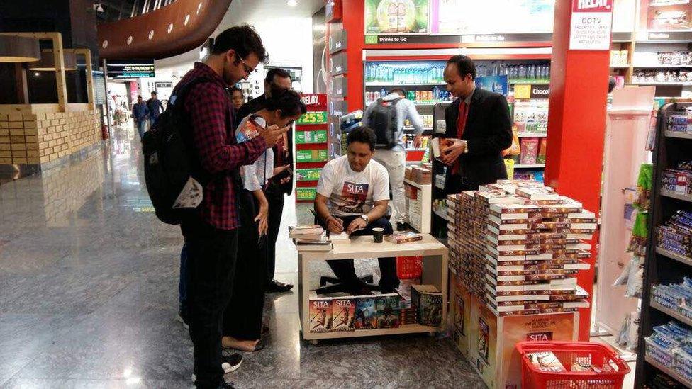 Author Amish Tripathi signs copies of his latest book