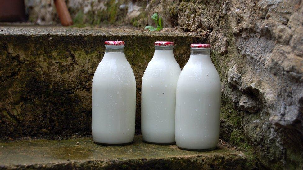 photo shows three pints of milk on a step