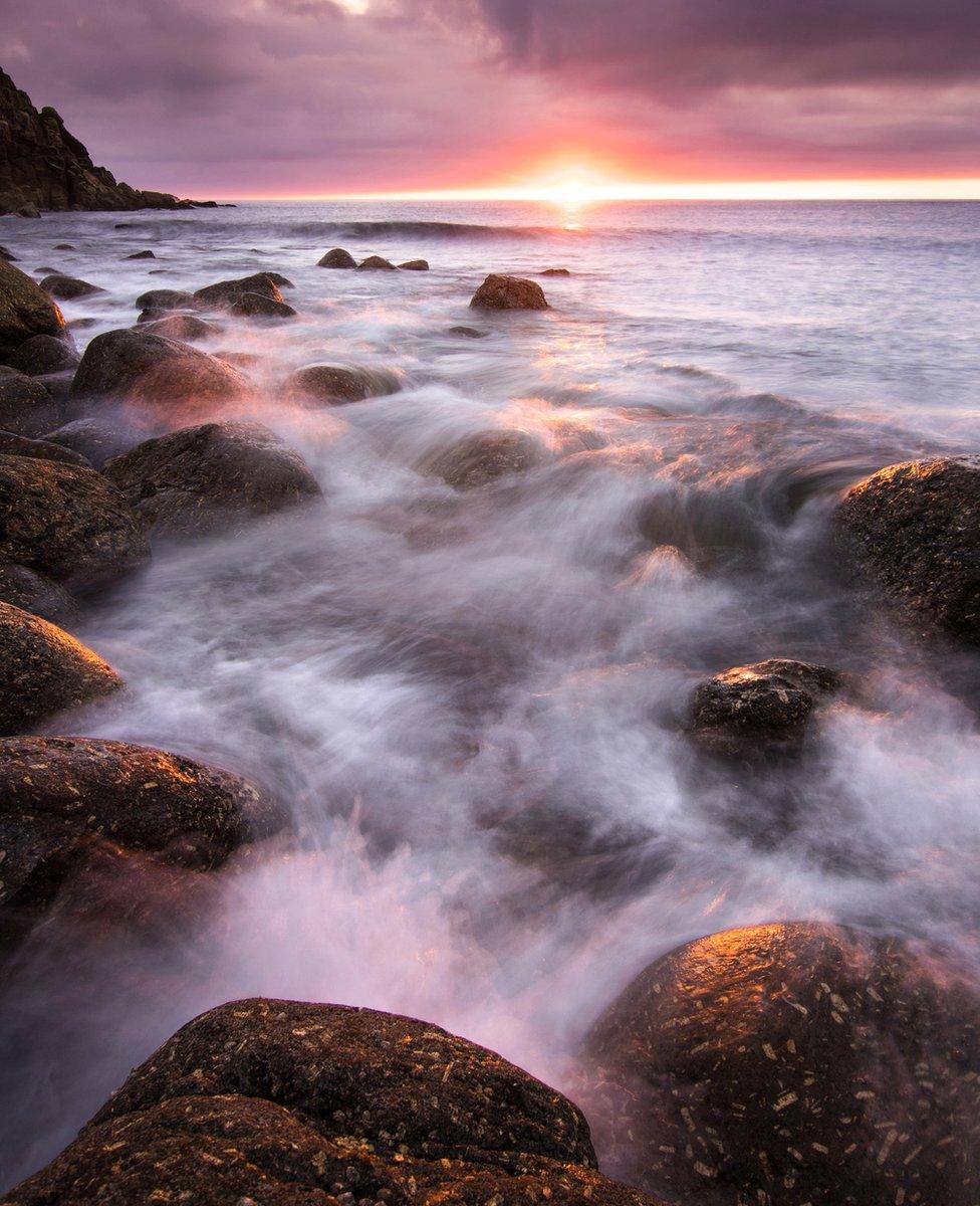 Water and fog rushing over rocks