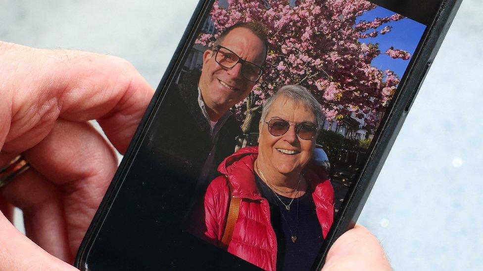 Noam Sagi views a recent photograph of himself with his mother Ada