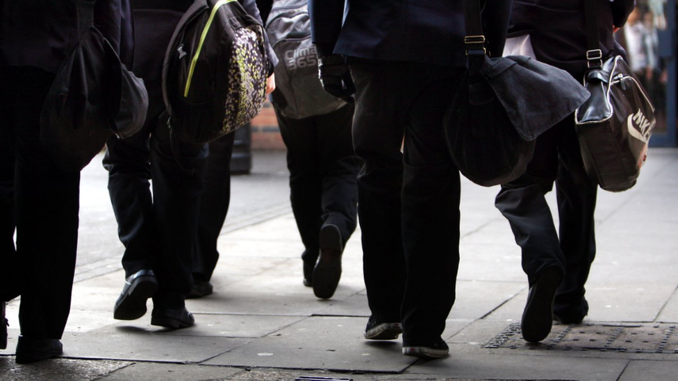 Generic stock picture of pupils from behind