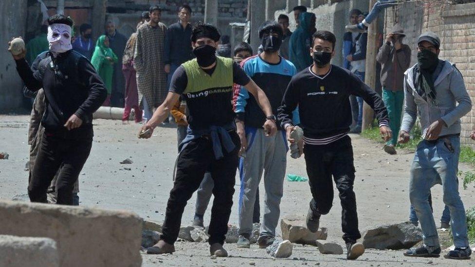 Kashmiri protestors clash with Indian security forces near a polling station in Srinagar on April 9, 2017