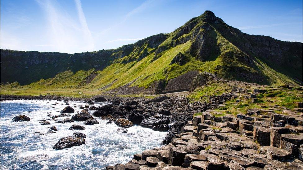 Landscape of Giant's Causeway trail with a blue sky in summer in Northern Ireland, County Antrim.