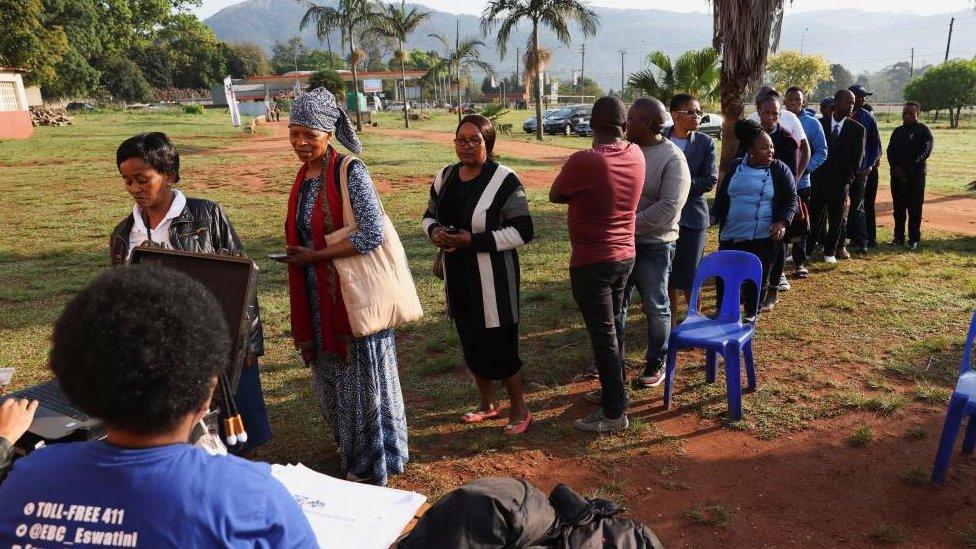 People queue outside a polling station during the Eswatini's parliamentary elections in Mbabane, Eswatini, September 29, 2023