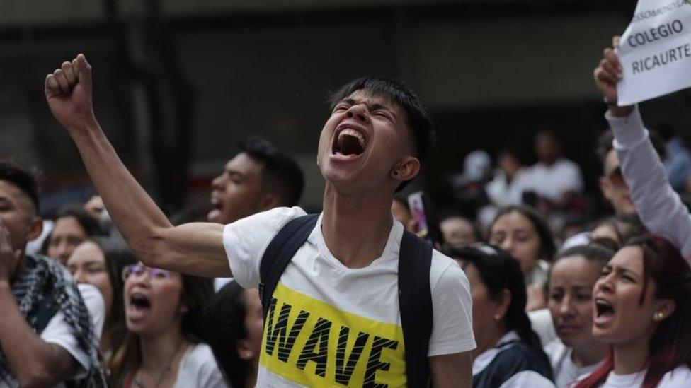 A protester reacts in the street where Dilan Cruz was injured in Bogota, Colombia November 24, 2019