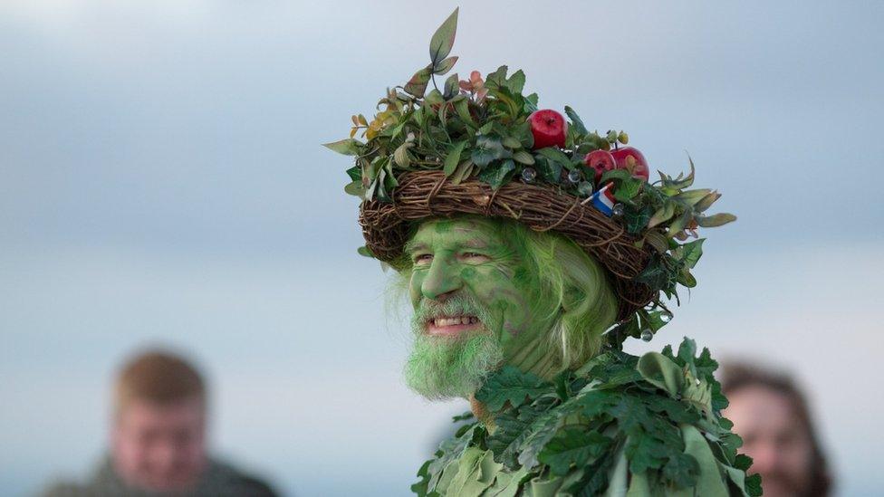 A man dressed as the Apple Tree Man at the 2018 May Day celebration at Glastonbury Tor in Somerset