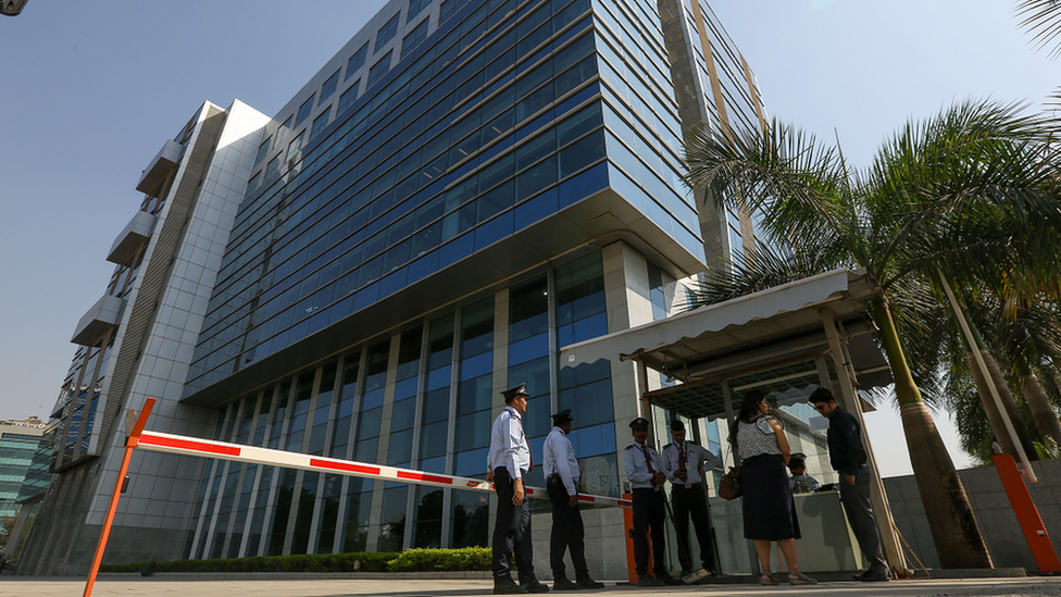 Security personnel stand guard outside the 鶹Լ's office in Mumbai