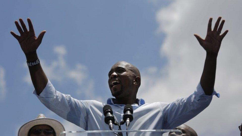 Mmusi Maimane, is seen addressing some of the thousands of people who attended a party march through the streets of downtown Johannesburg , South Africa, 27 January 2016