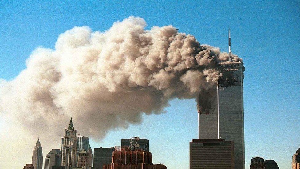 Smoke plumes from the twin towers of New York's World Trade Center, shortly after the attack on 11 September 2001`