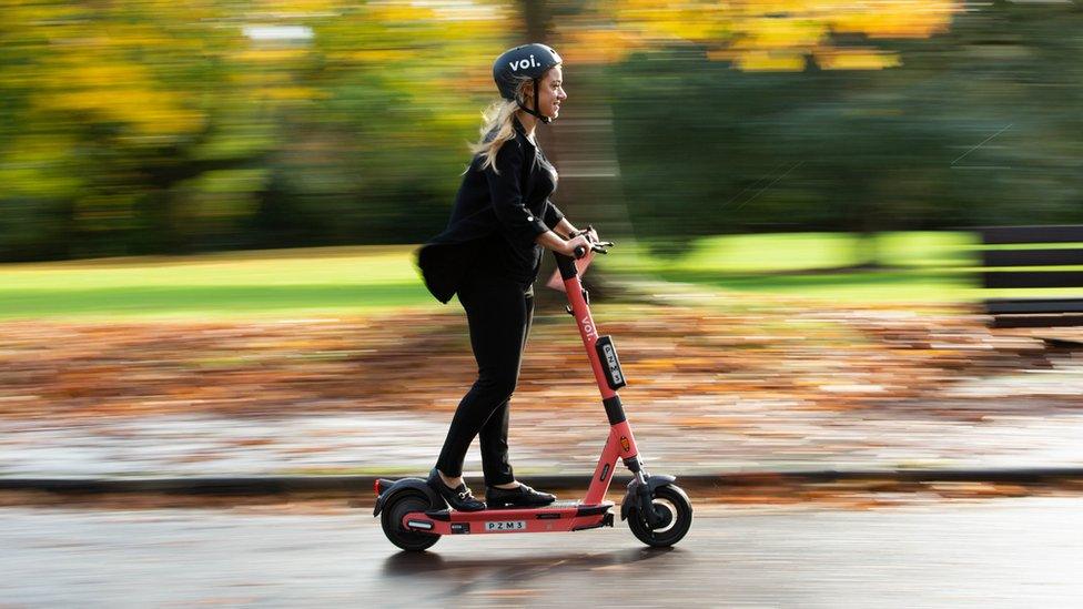 Woman on an e-scooter