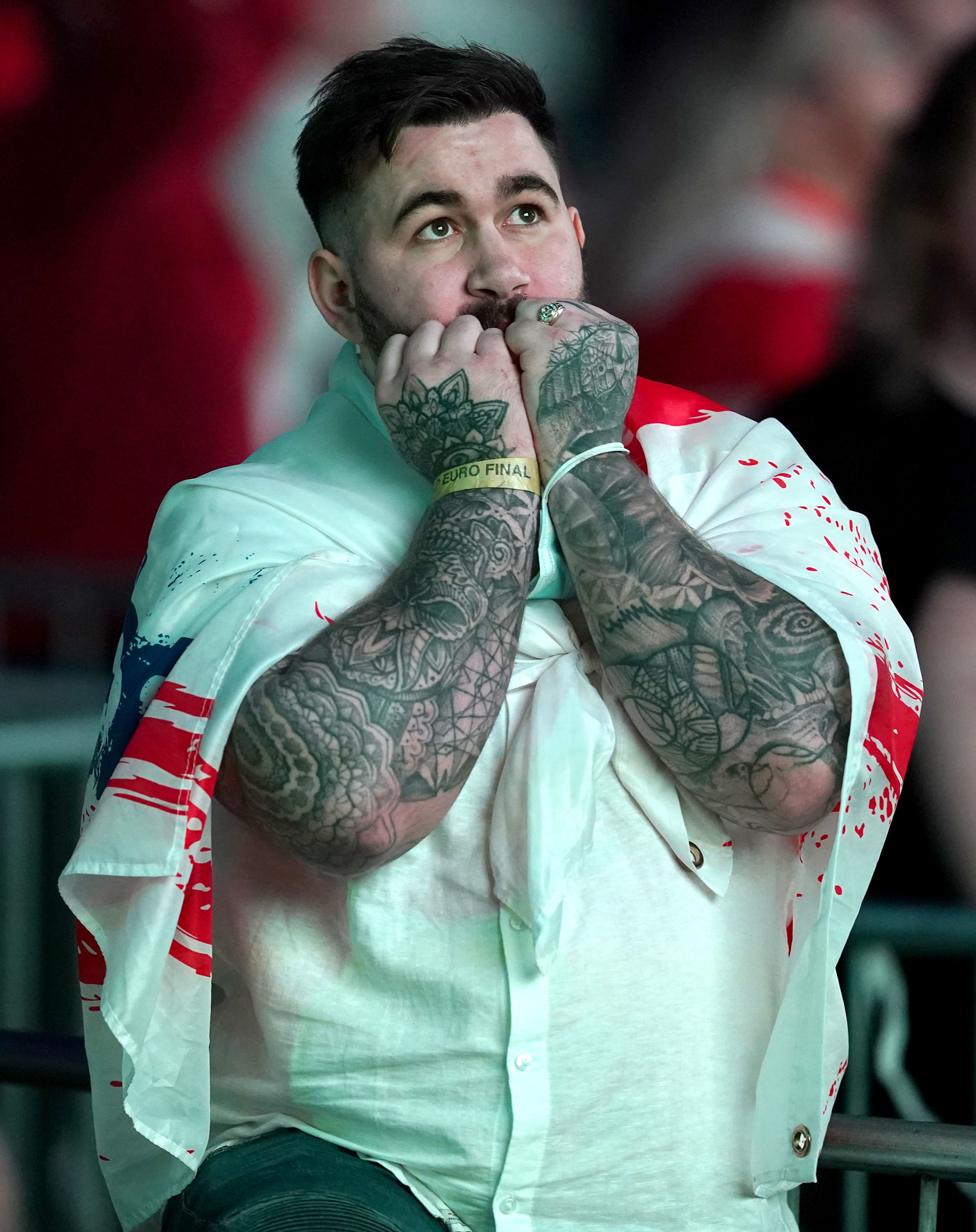 An England fan look nervous in the second half of extra time at the fan zone in Trafford Park, Manchester as they watch the UEFA Euro 2020 Final between Italy and England. July 11, 2021.