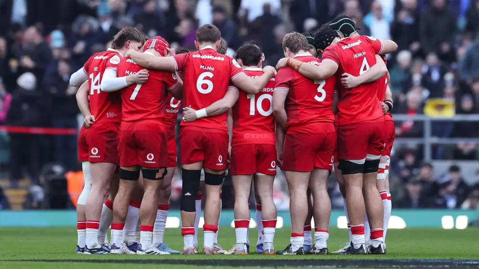 Wales players in a huddle against England