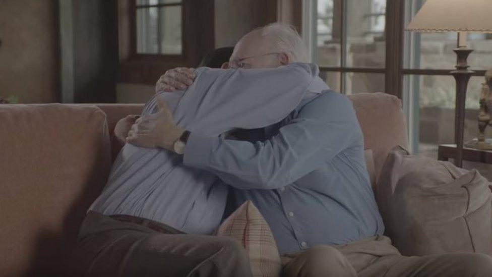 Ted Cruz and his father hug in a still from a YouTube video