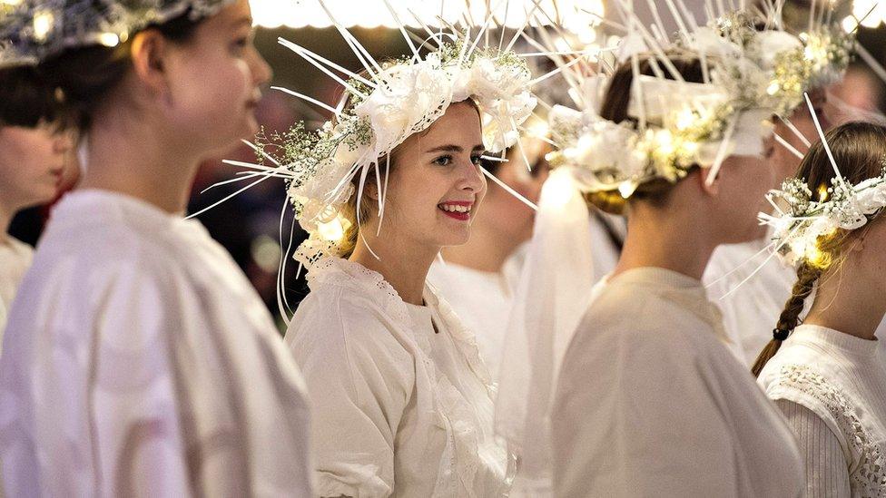 Danish chorus girls wait for Denmark's Queen Margrethe to arrive at the Music House in Aarhus, Denmark, on January 21, 2017