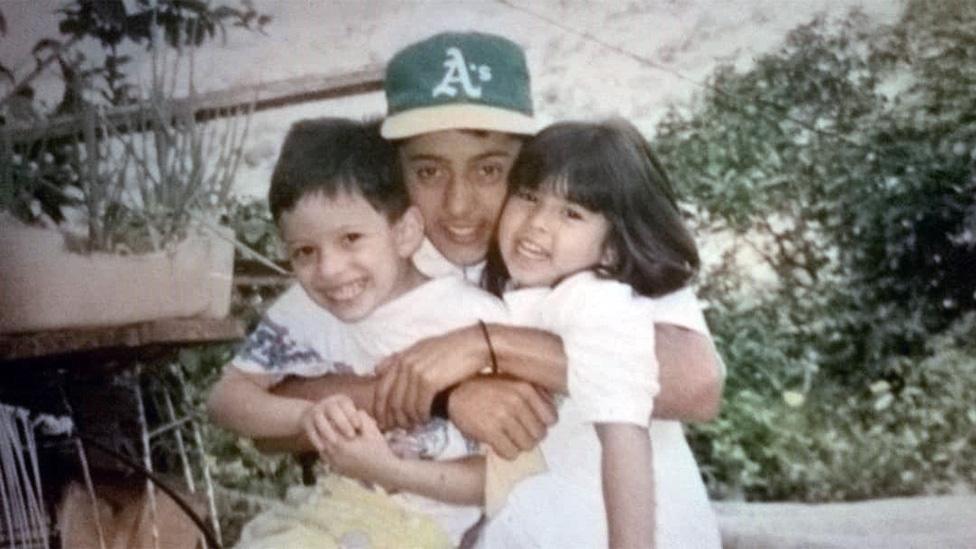 Jose with one of his brothers and a niece in the 90s