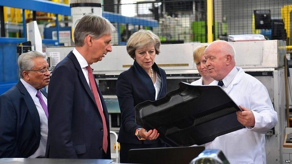 Philip Hammond and Theresa May during a visit to a manufacturing centre at the University of Warwick last month