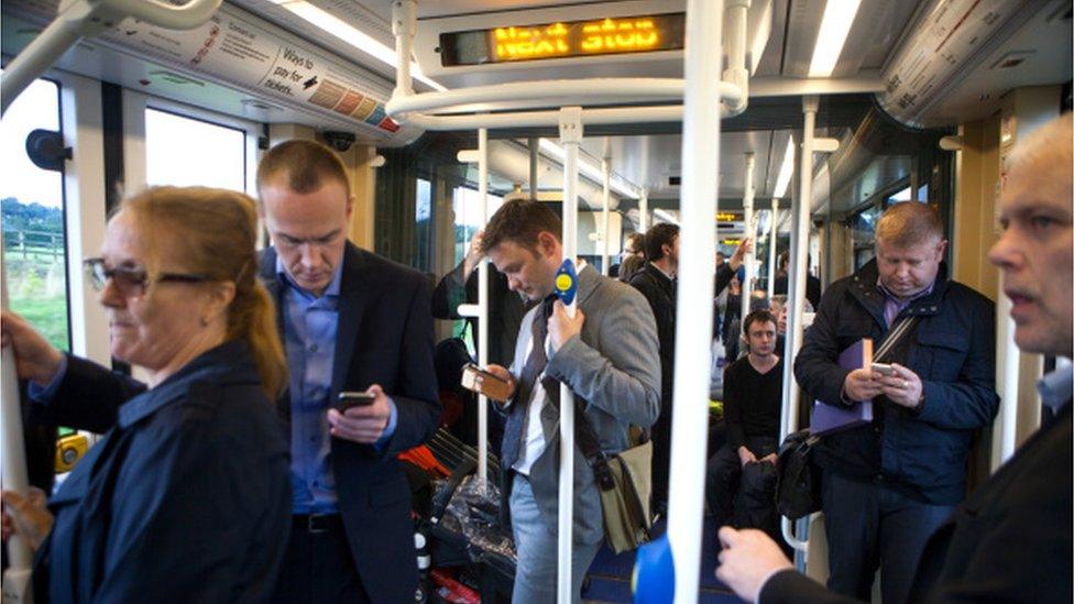 People standing on Edinburgh tram