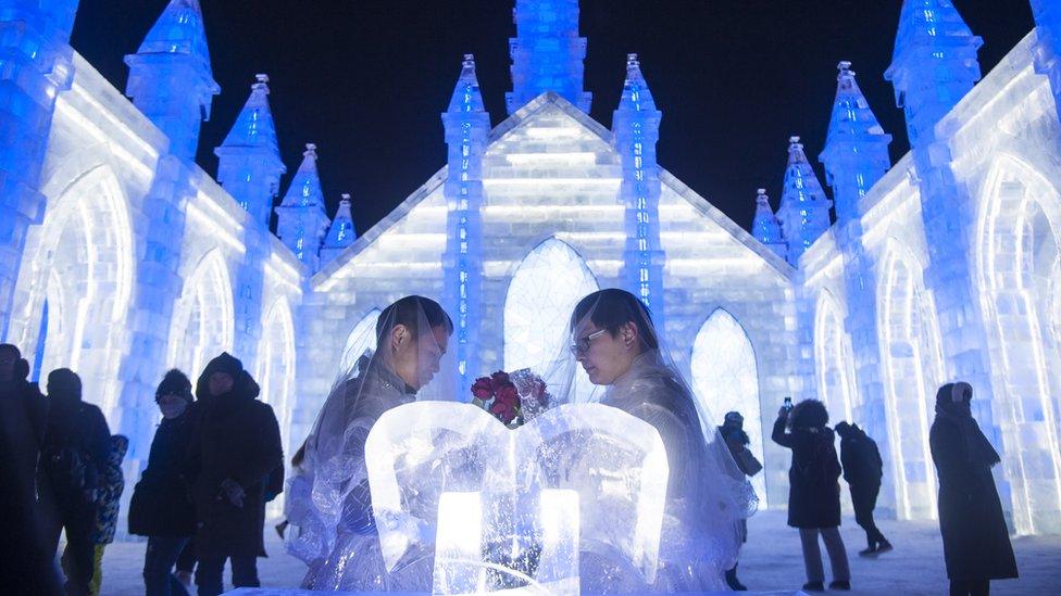 Couple taking part in the wedding ceremony.