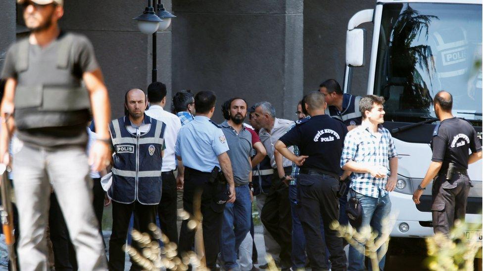 Military personnel, suspected of being involved in the coup attempt, are escorted by policemen as they arrive at the Justice Palace in Ankara, Turkey, July 18, 2016.