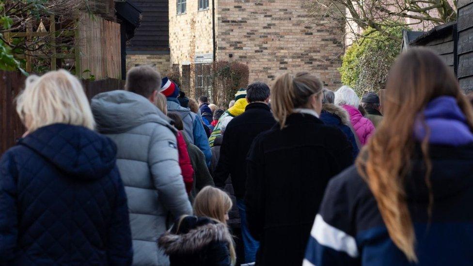 People on a walking tour in Duxford