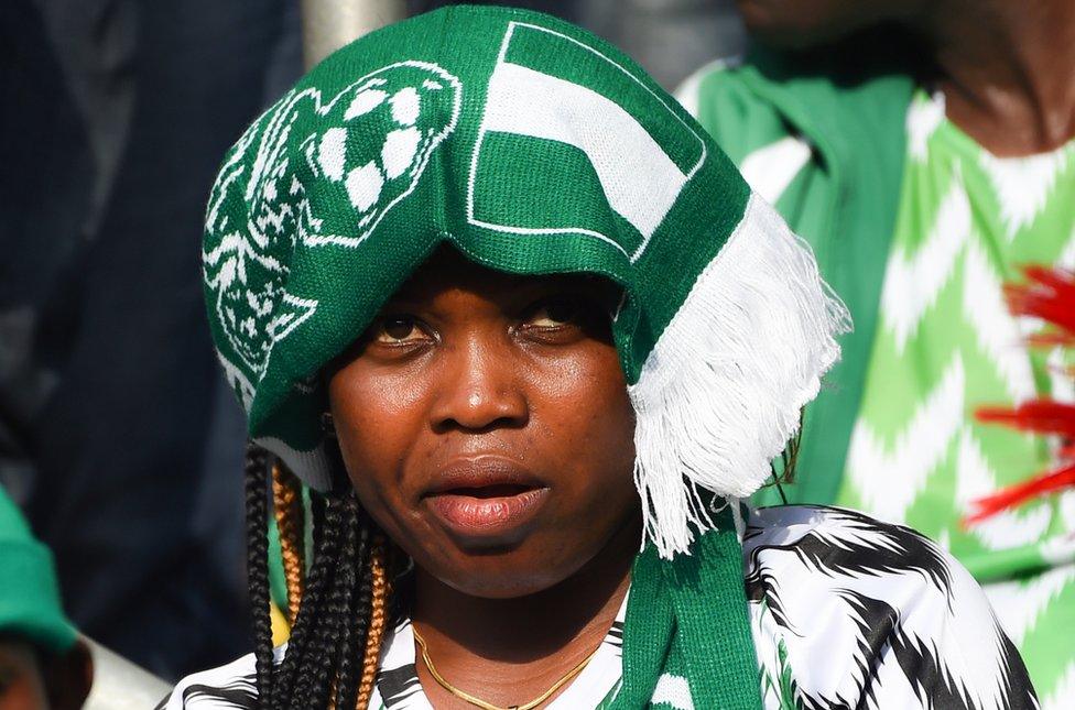 A supporter looks on during the African Cup of Nations qualification match between Nigeria and Libya in Uyo, Akwa Ibom State in southern Nigeria, on October 13, 2018. - Nigeria beat Libya 4-0 with Odion Ighalo grabbing a hat-trick for the Super Eagles to get their 2019 Africa Cup of Nations qualifying campaign firmly back on track in Uyo, southern Nigeria