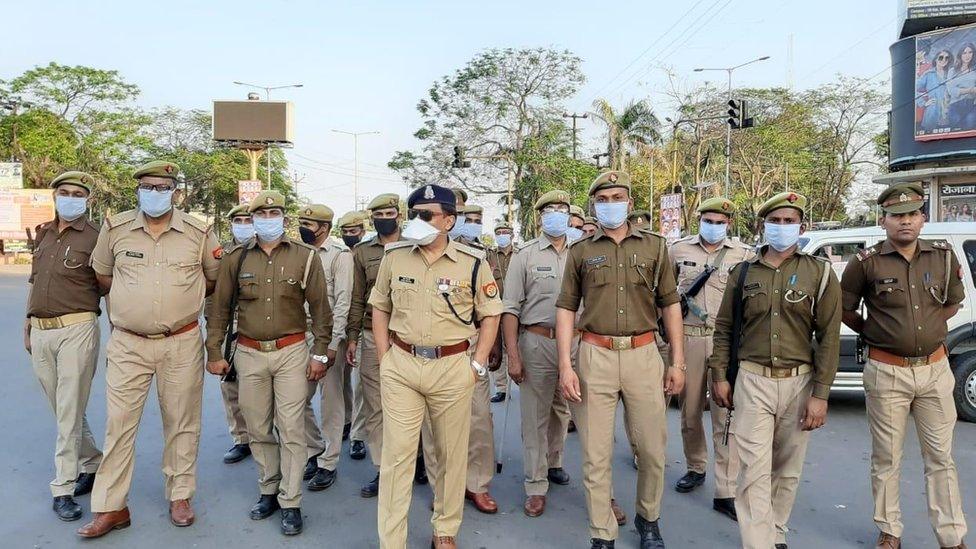 Indian police patrolling wearing face masks