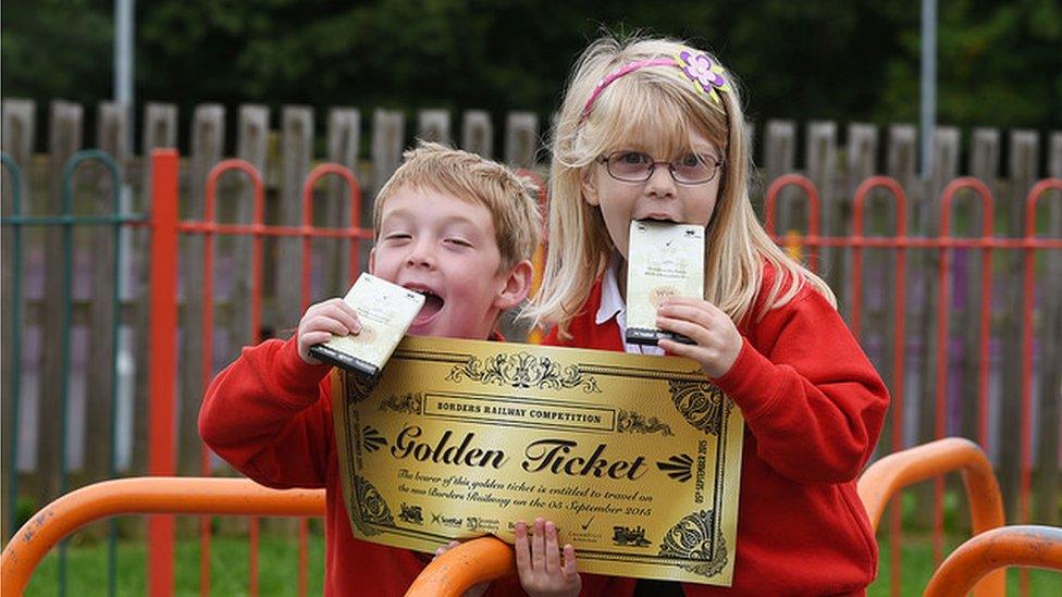 Golden Ticket promotion at Tweedbank Primary School. Angus Parker and Emily MacClure hold bars of Cocoa Black chocolate and a giant Golden Ticket.