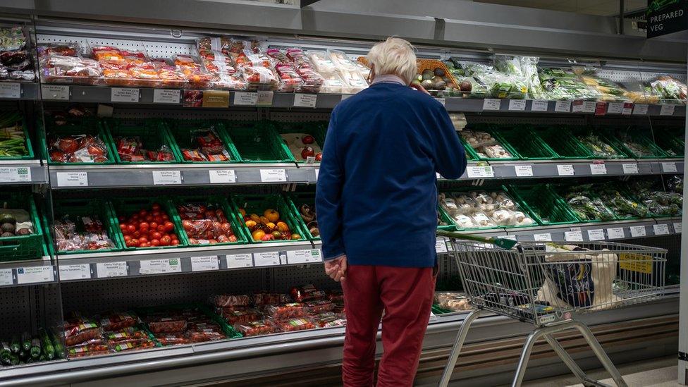 Man shopping in supermarket