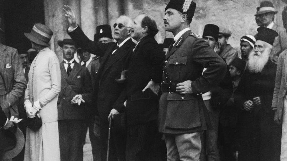 Arthur Balfour (arm raised) in Jerusalem in 1925