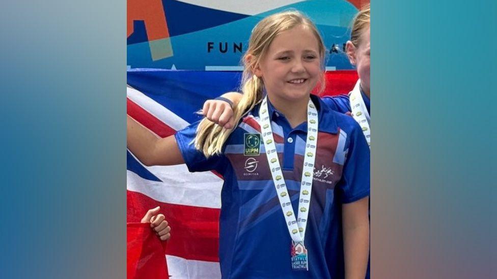 Evie Wilkinson wearing a medal at the European Championships in Madeira